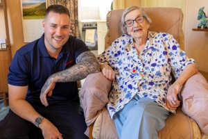 Luke, a Safe and Well officer, with Hilda who is Kent's oldest resident