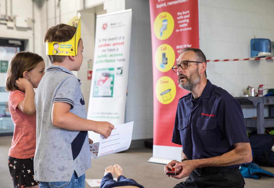 Children learning about first aid from KFRS medical expert