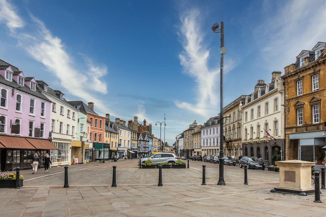 high street lined with shops and pedestrian walkway