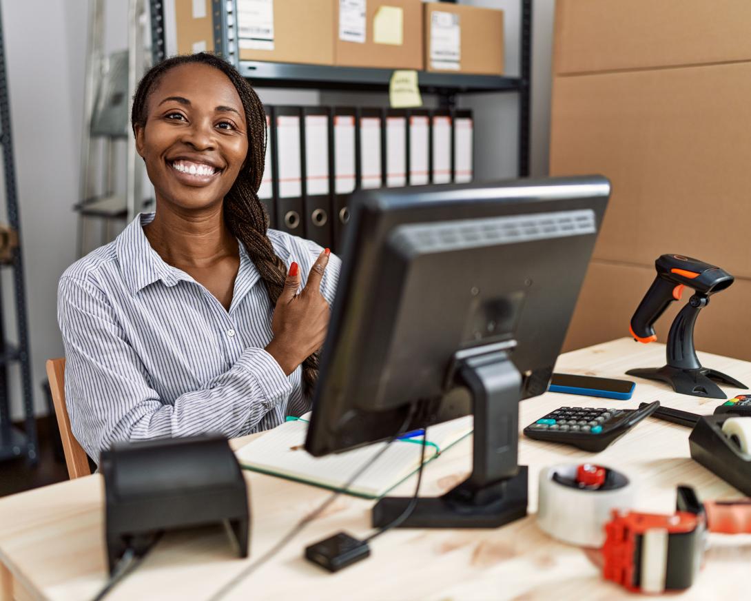 woman sitting at desk in non-domestic building