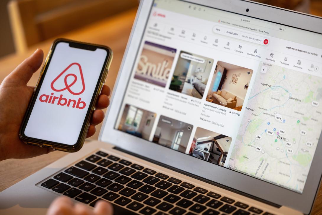 laptop and phone displaying the Air bnb site