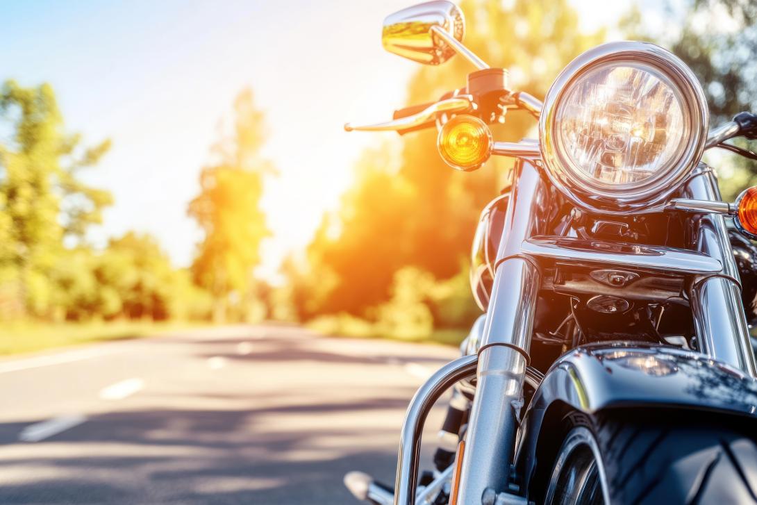 motorbike parked by side of country road