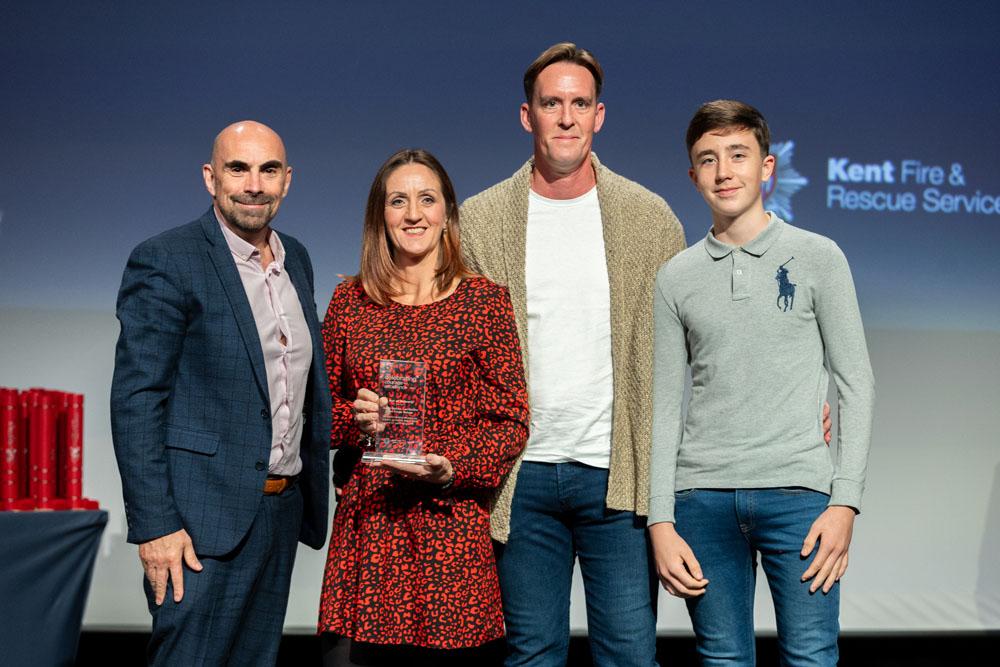 The Malone family collecting their award