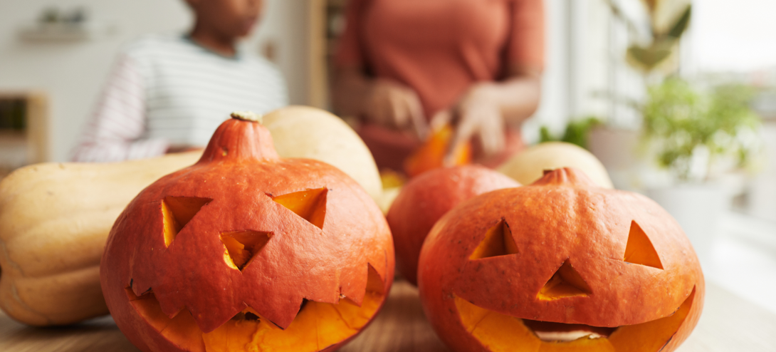 Two pumpkins that have been carved 