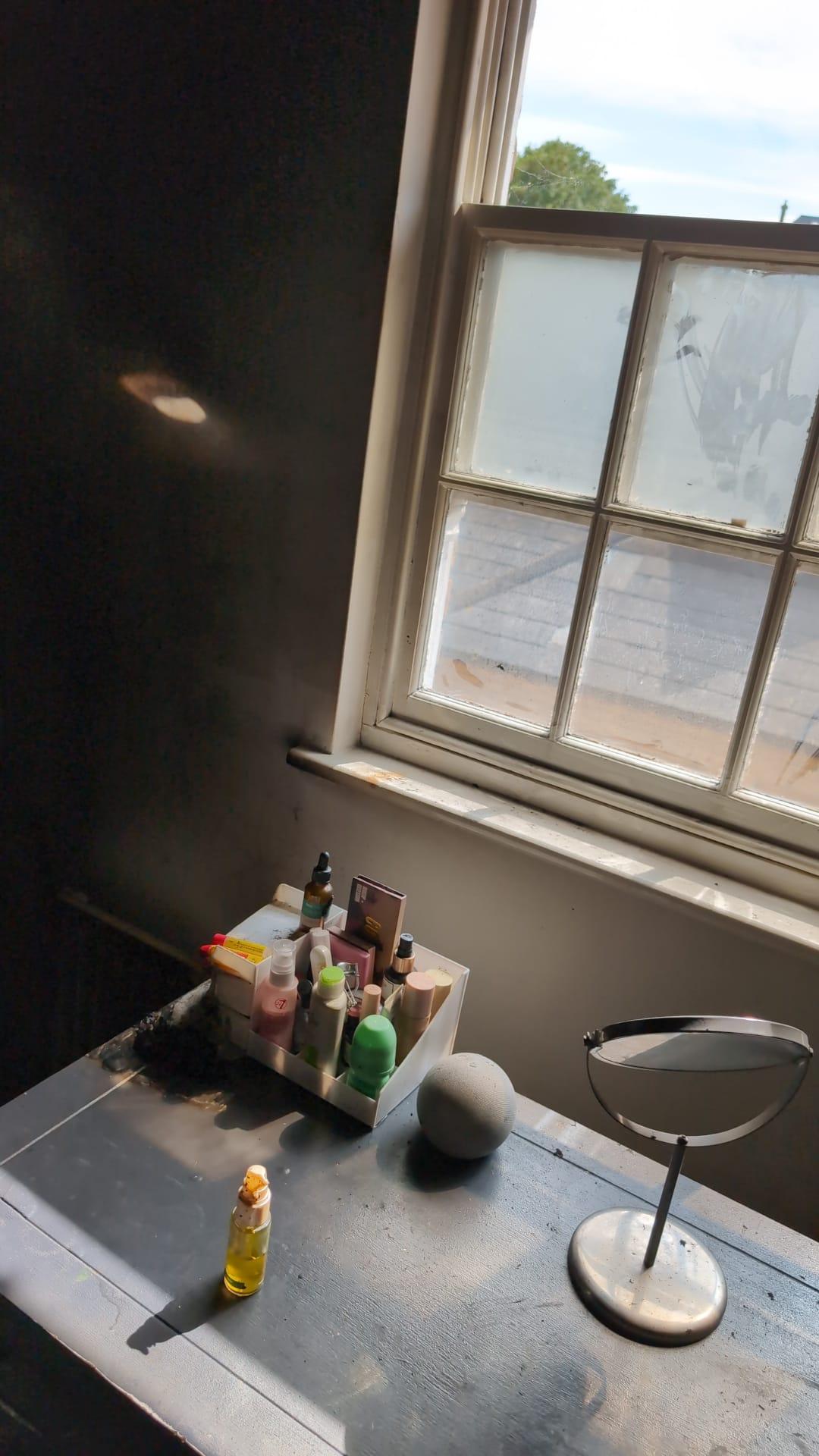 Damage to a bedroom caused by a fire from a vanity mirror