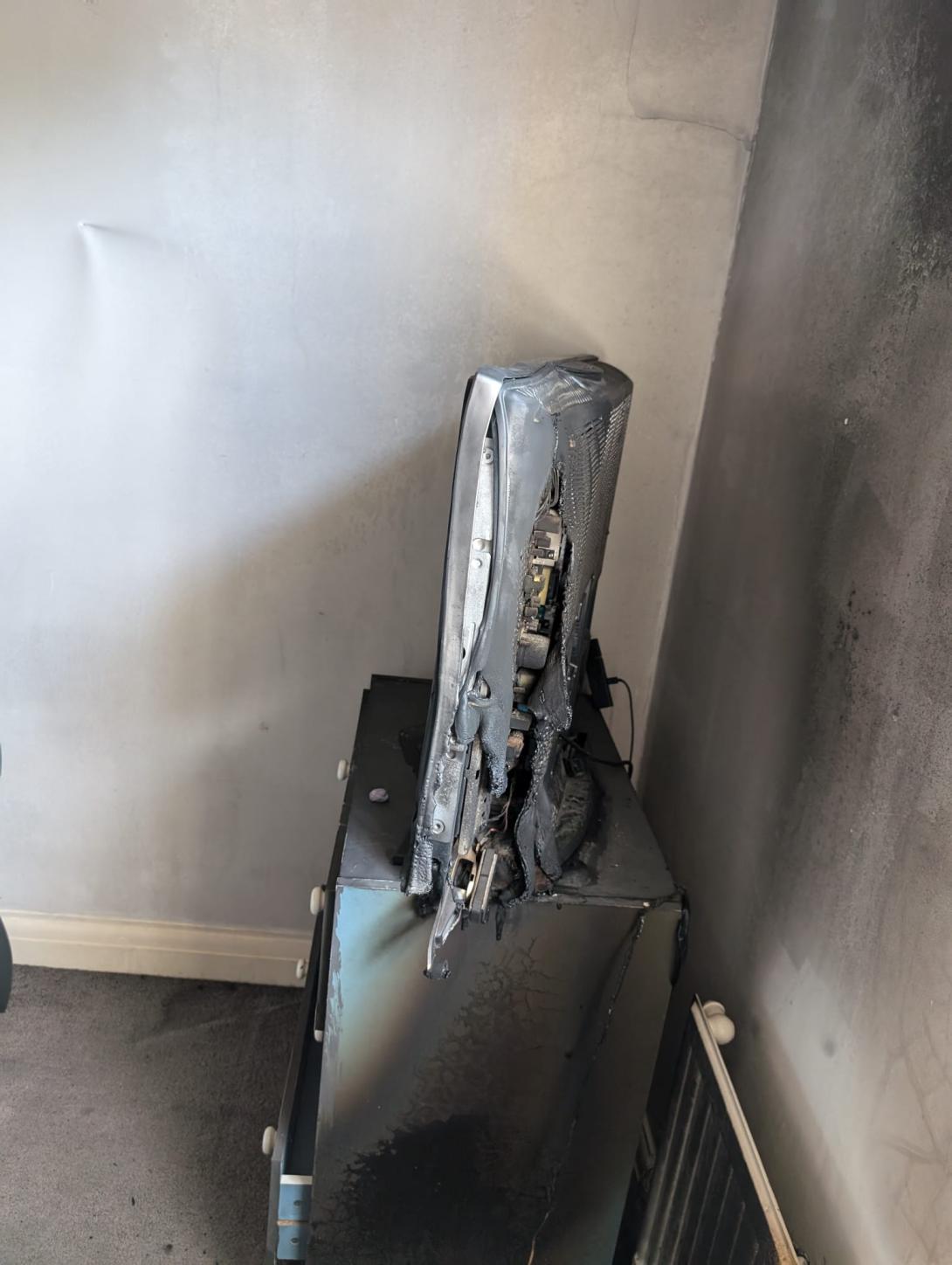 Damage to a bedroom caused by a fire from a vanity mirror