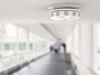 smoke alarm on ceiling of a corridor